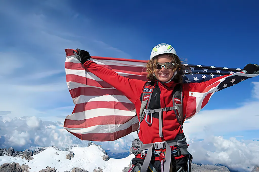 Jordon Romero waving flag