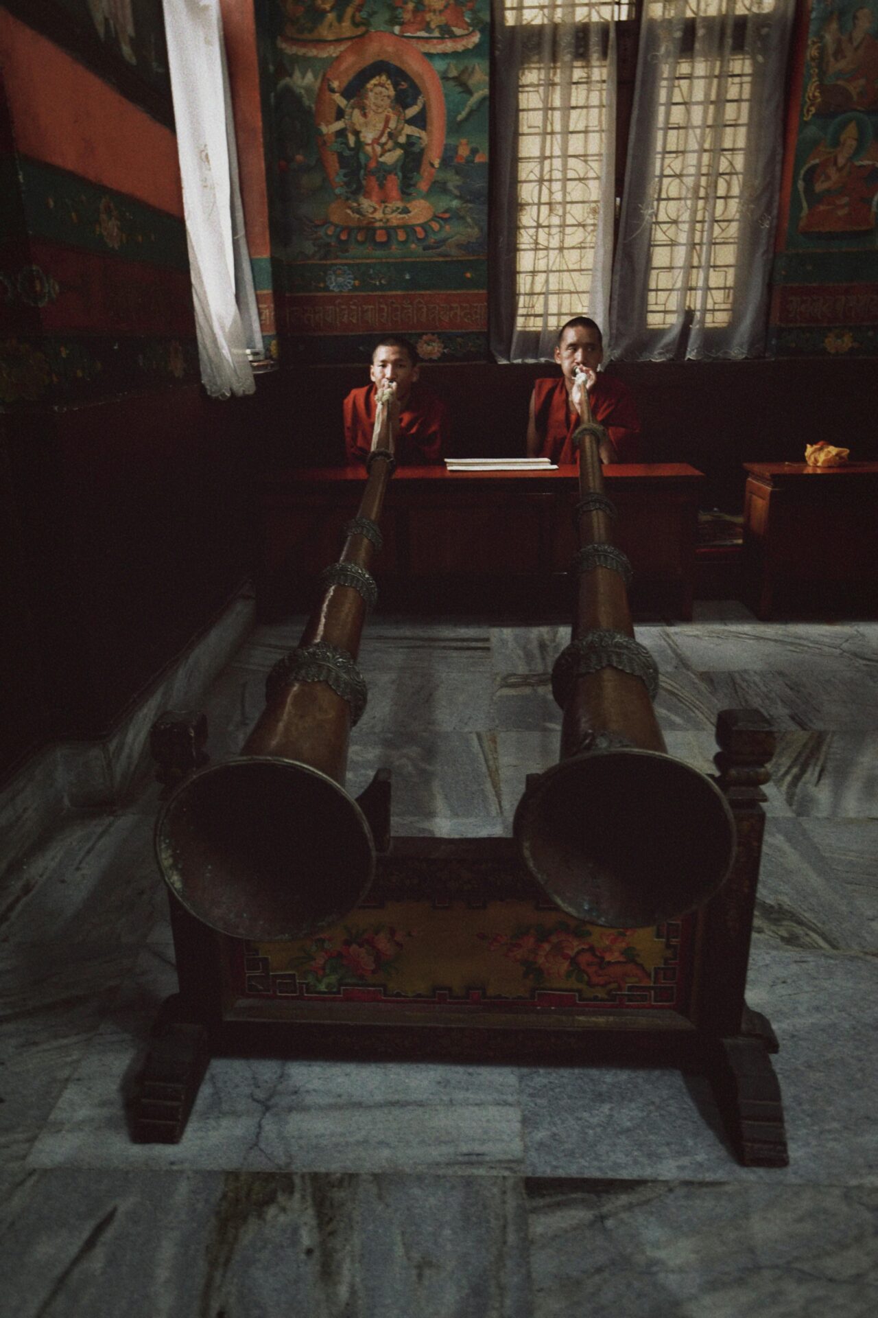 Monks playing Trumpets