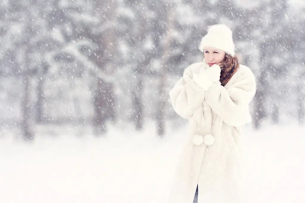 woman enjoying snowfall