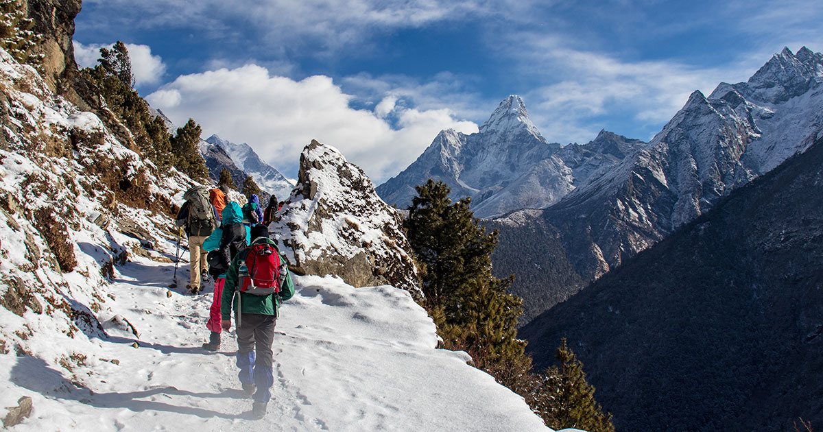 image of trekkers in mountains.