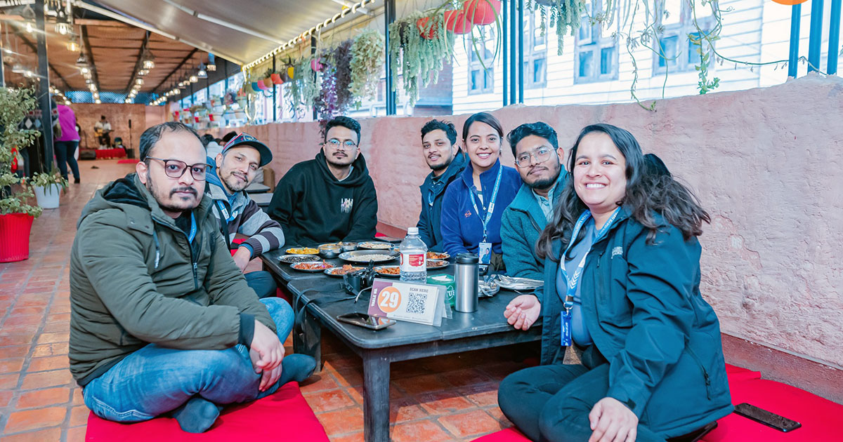 Image of young people enjoying traditional Newari cuisine in Kathmandu.