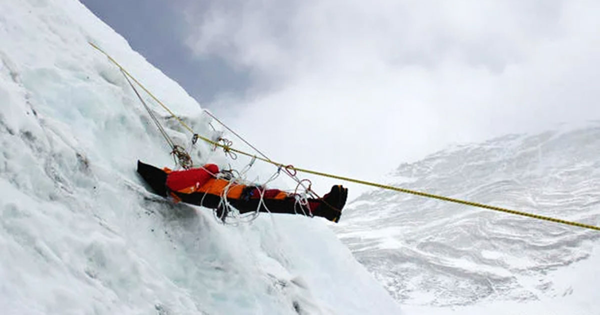 Image of a dead body being recovered.