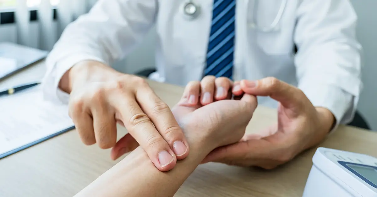 Doctors checking patients pulse