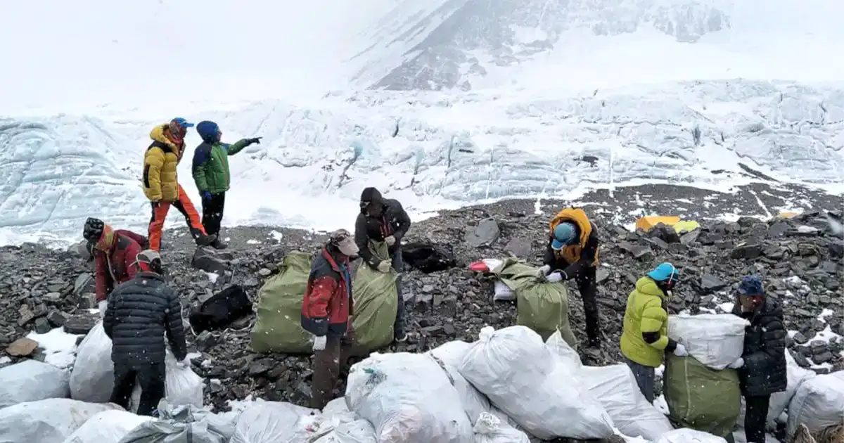 Picture of people Clearing trash piled up in EBC 