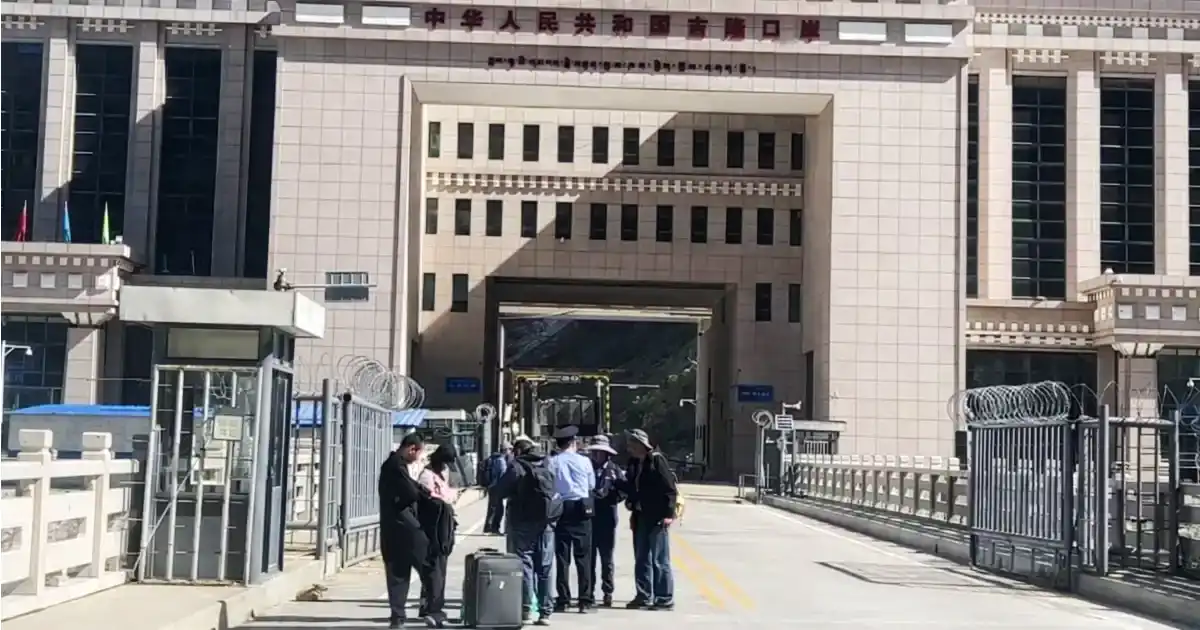 Travellers checking their phones on the way to Kailash