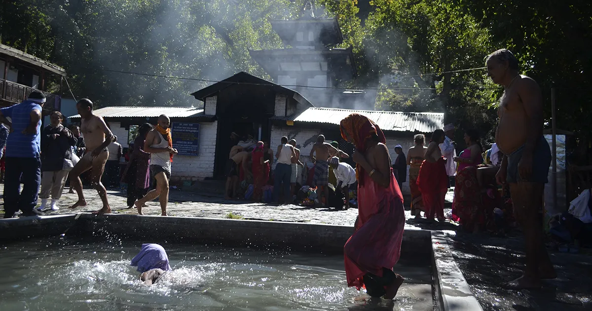 People Taking a Dip in Muktinath Temple