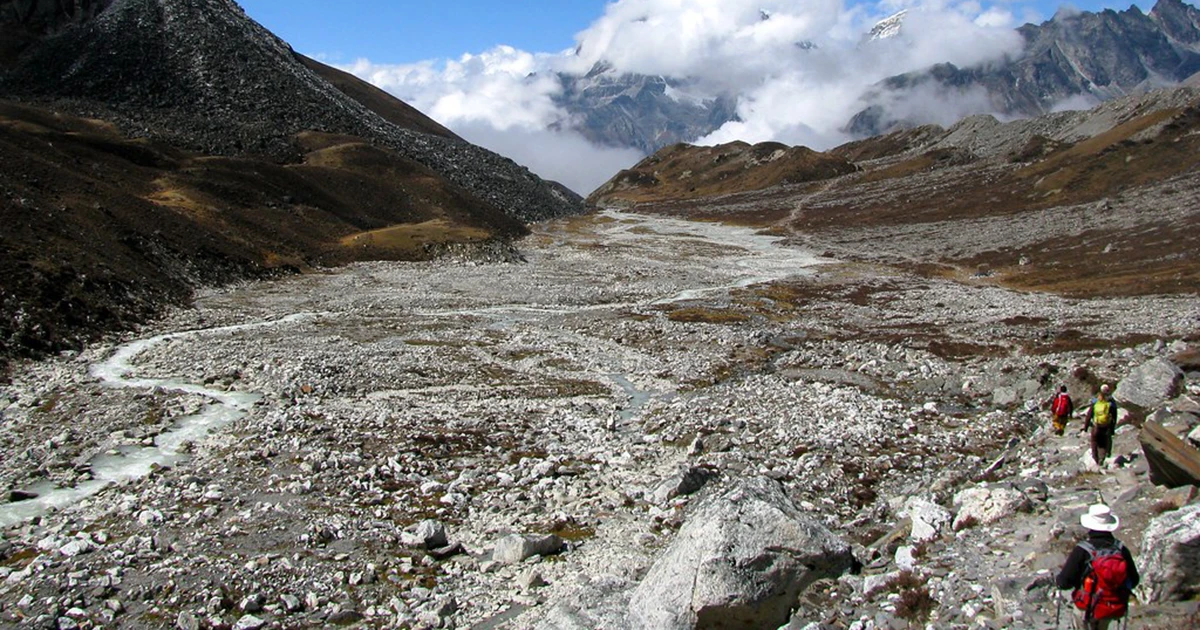 Trekkers in Everest Base Camp with Island Peak's route