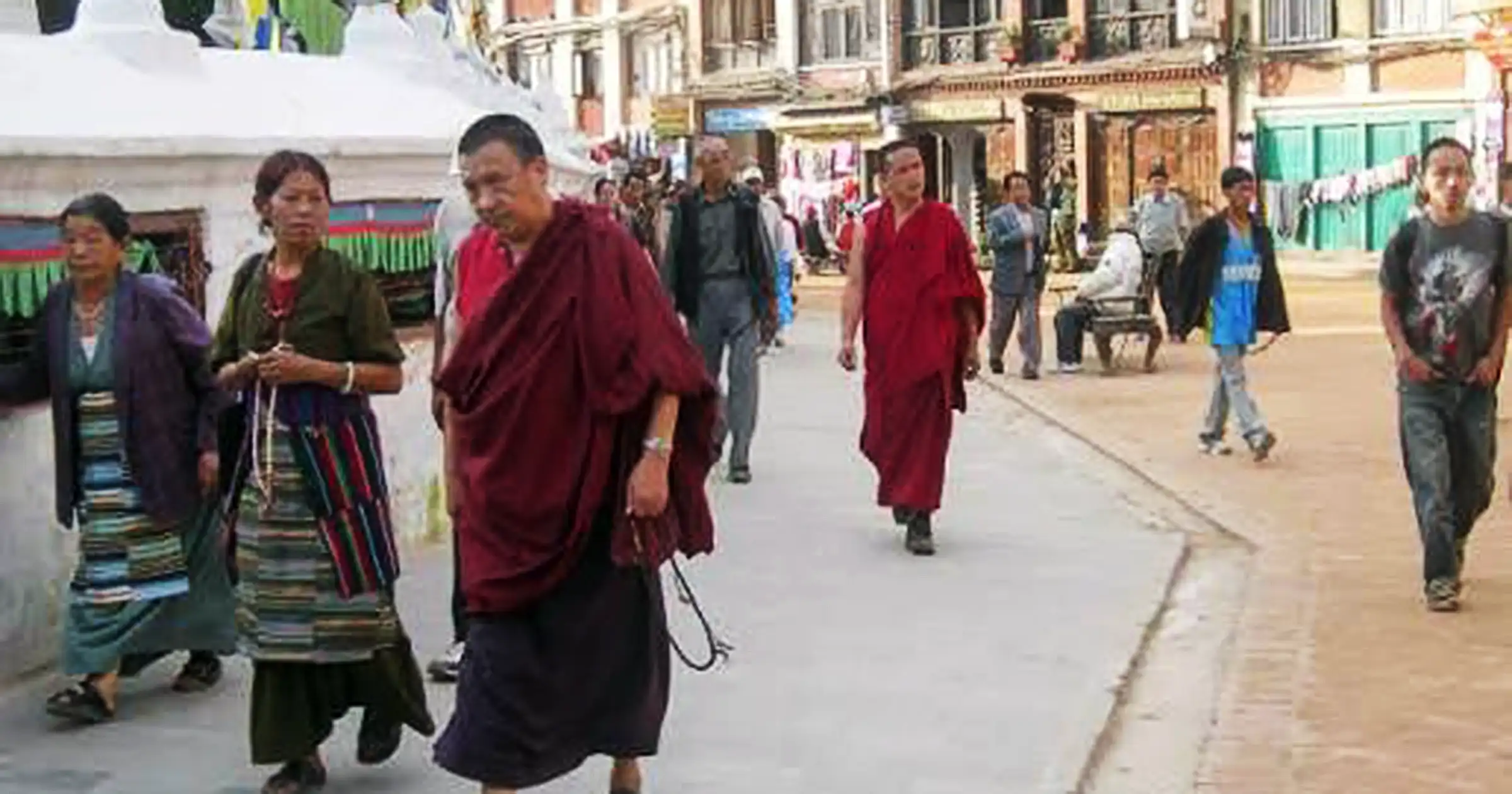 Monks walking in clockwise direction Boudhanath